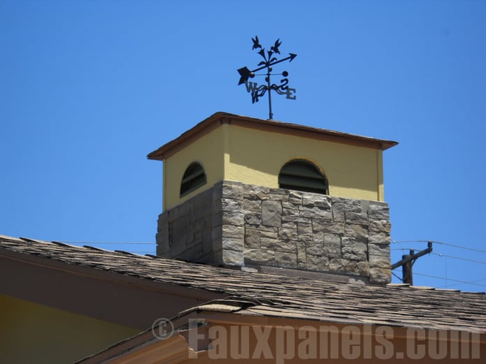 A faux stone chimney surround adds a touch of style to your home's exterior design.