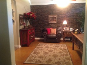 By adding a faux stacked stone accent wall, Holly and her husband brought new life into their home office.