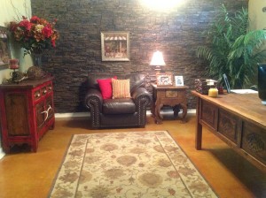The faux stacked stone wall added contrast but also complemented the tone of the leather chair.
