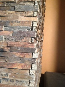 Mitered faux panels and pre-molded faux stone corners don't suffer from this design killing corner issue.