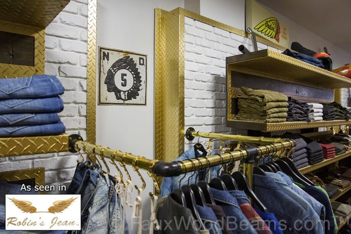 Faux brick panels in glacier white are a pleasant touch to clothing store decor.
