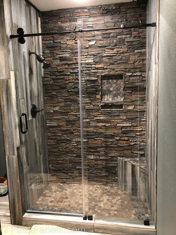 Shower wall covered with Norwich Stacked Stone.