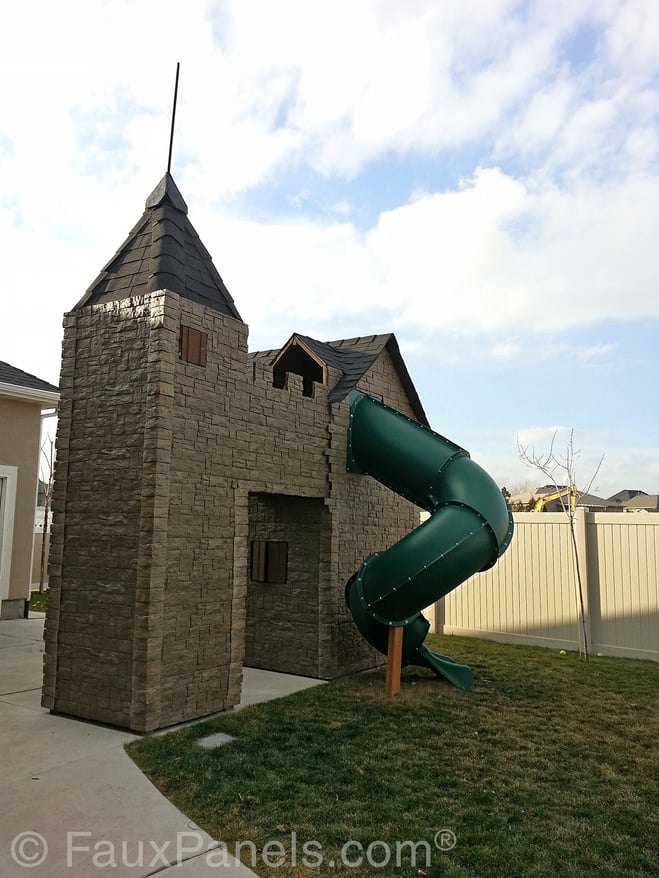 Castle style backyard playhouse with tub slide