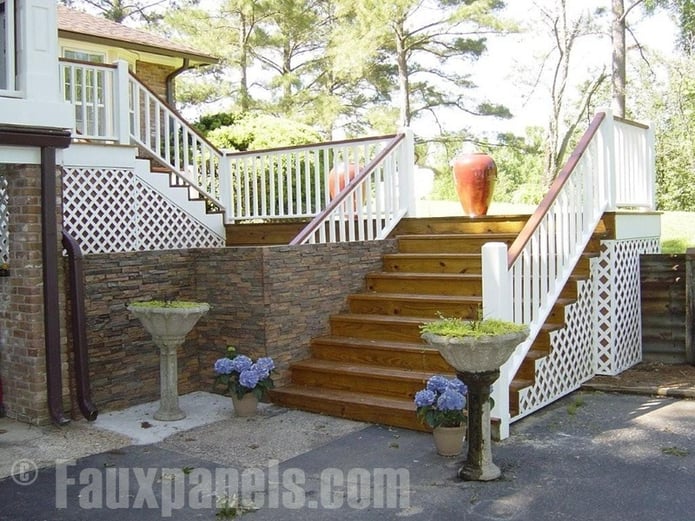 A home's elegant side steps look great framed with faux stone siding.
