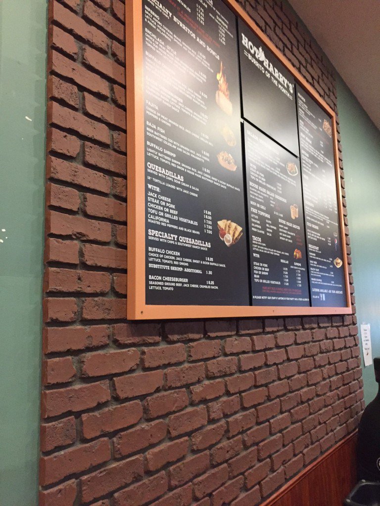 Brick veneer wall panels accent a burrito restaurant's menu board