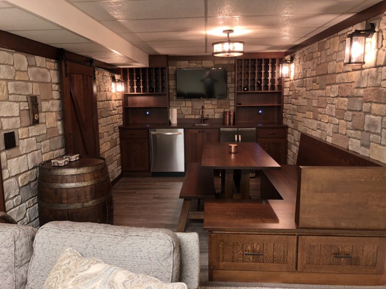 French-style tavern built in a home's basement with Carlton Cobblestone panels on the walls.