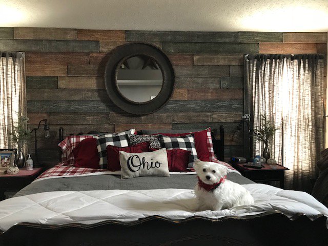 Bedroom accent wall created with Wellington Reclaimed Barn Board panels.