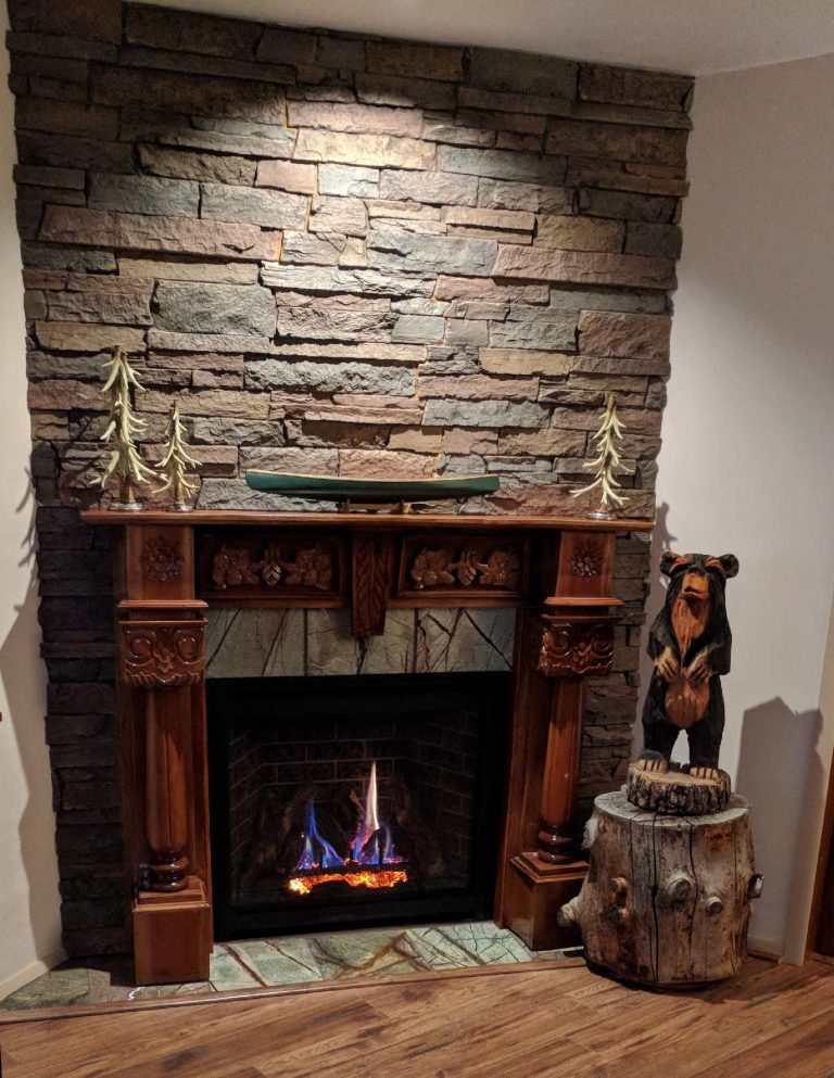 Fireplace surround made with Norwich Stone Wall panels in Earth color.