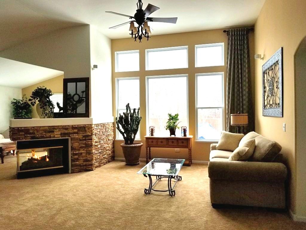 Living room with retro style, 3-sided fireplace.